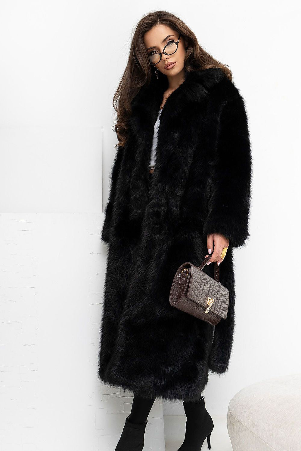 Elegant fur coat with a belt and a convenient fastening