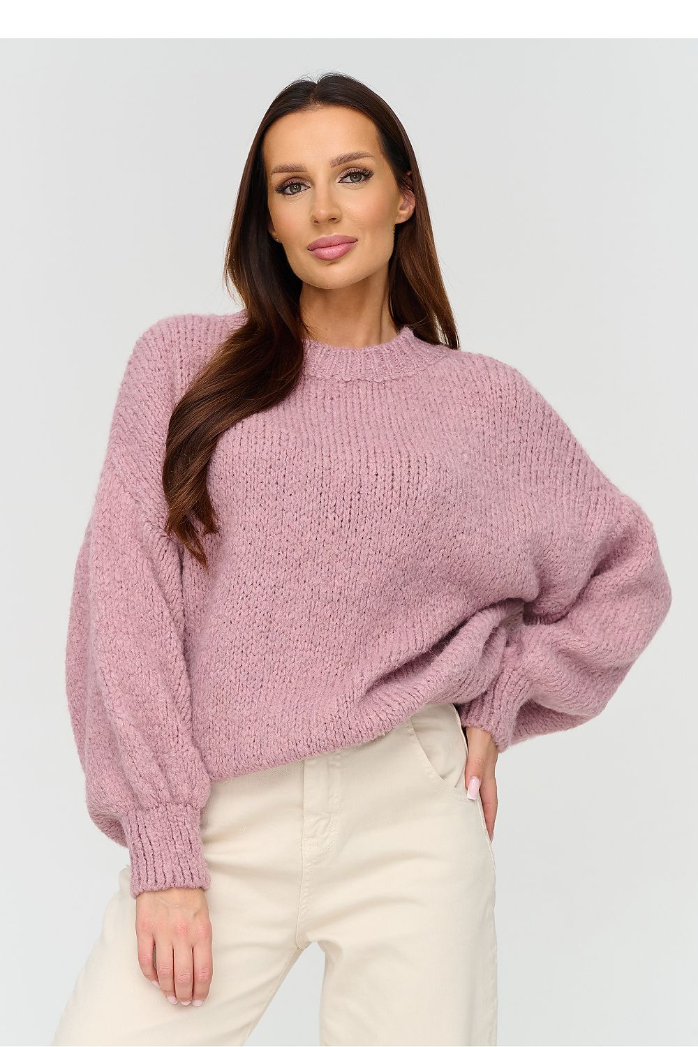 Pink sweater with a round neckline and a loose fit