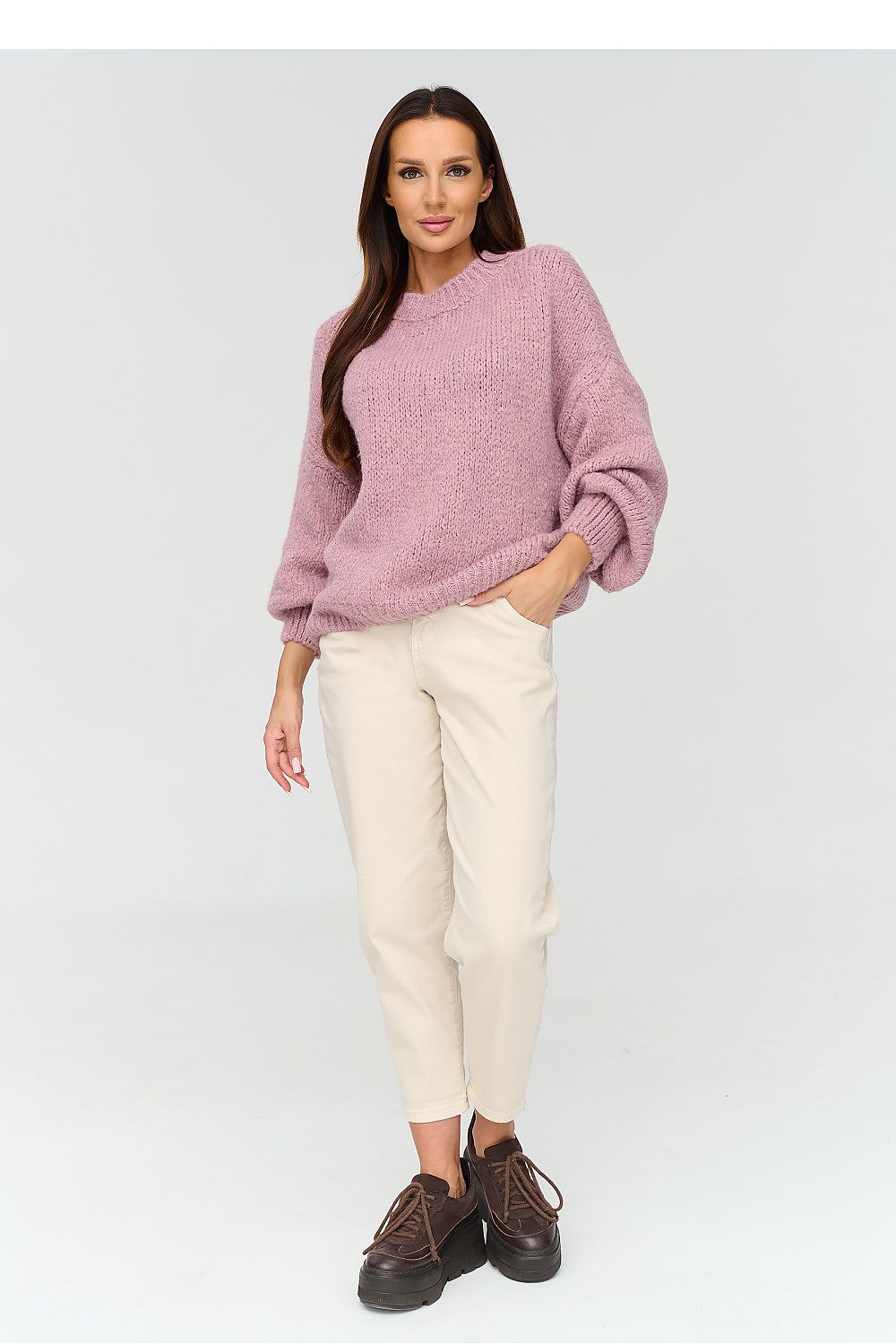 Pink sweater with a round neckline and a loose fit