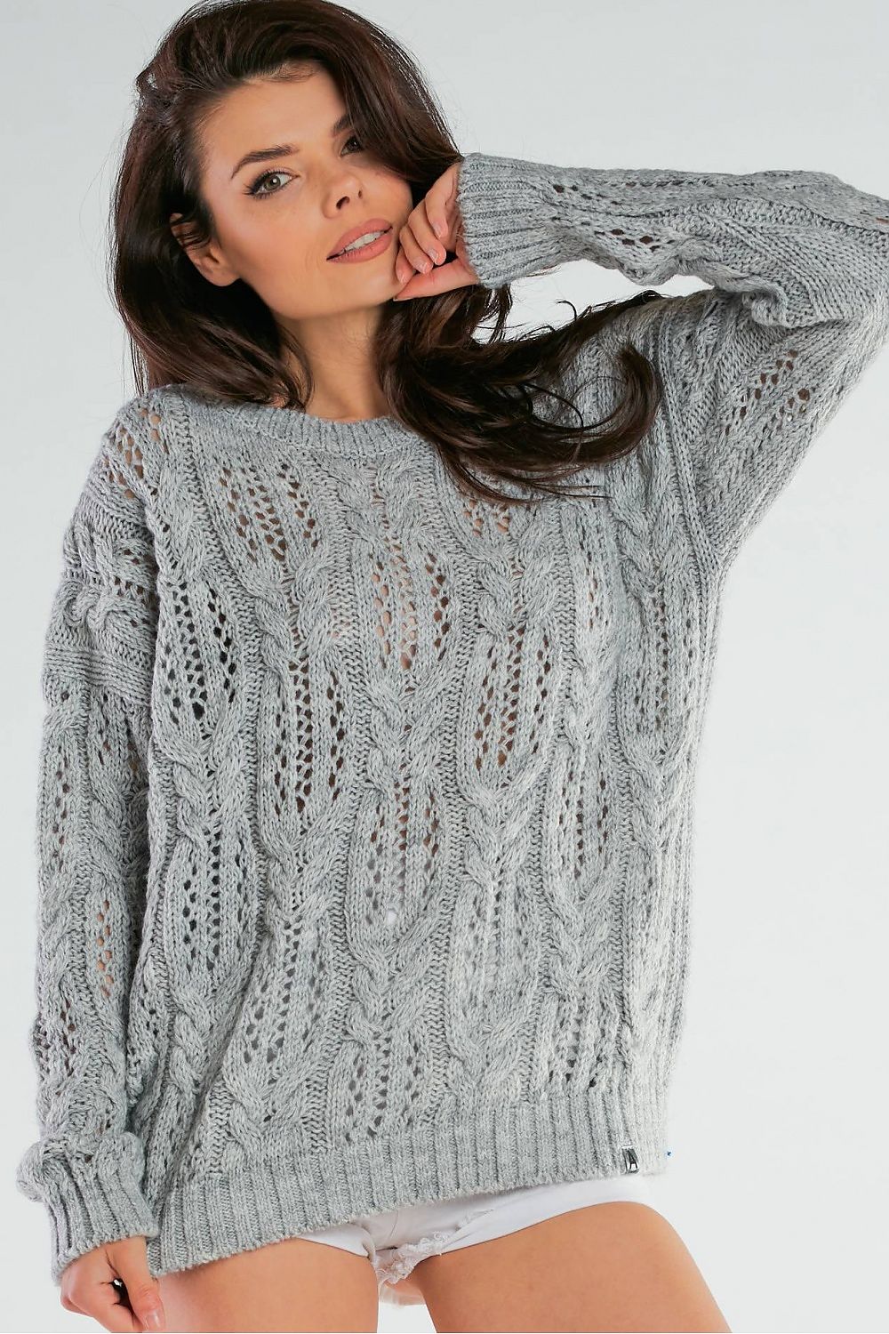 Grey sweater with an original knit pattern
